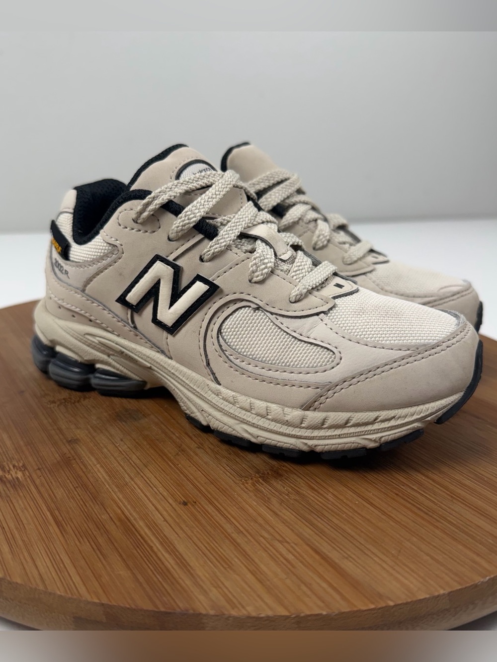 New Balance 2002r Kids Beige and Black Athletic Sneakers